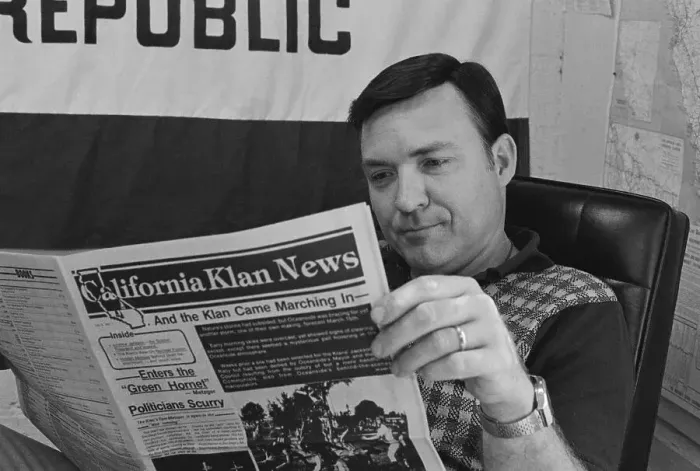 Framed Print : Tom Metzger Reading Newspaper