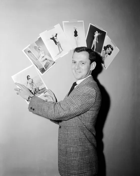 Framed Print : Tony Randall Pointing to Pictures of Actresses