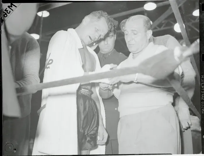 Framed Print : Tony Zale Getting Hand Examined After Fight Framed Print : Tony Zale Getting Hand Examined After Fight