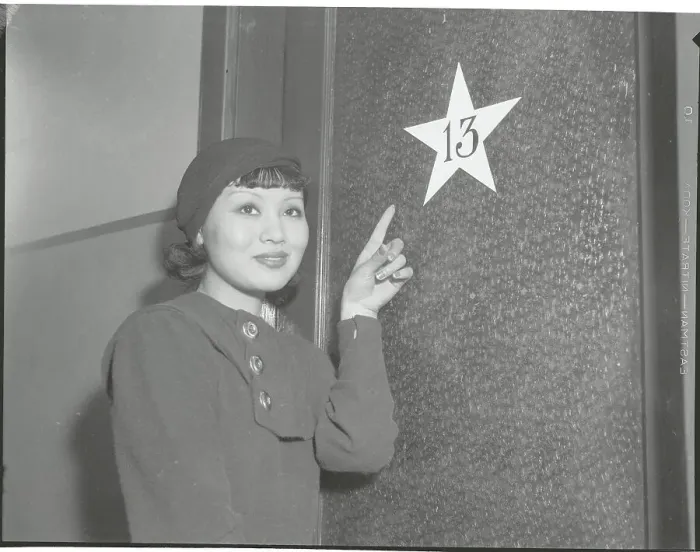 Framed Print : Toshia Mori Pointing to Dressing Room Number Framed Print : Toshia Mori Pointing to Dressing Room Number