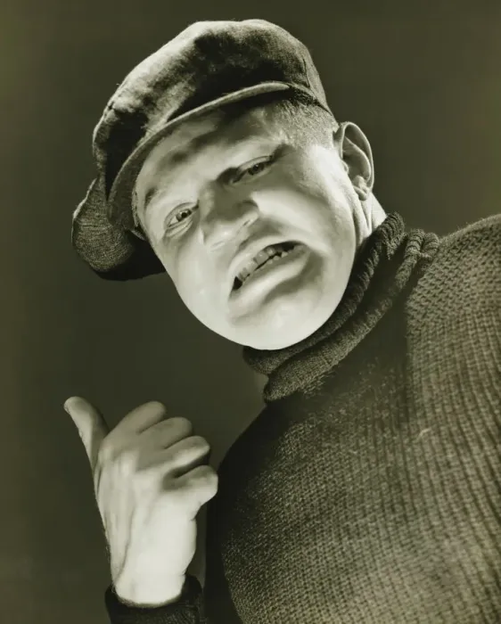 Framed Print : Tough guy showing thumb up, (B&W), close-up, portrait, low angle view