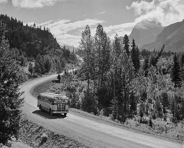 Tour Bus. A Skyline Tours bus on a road through the mountains circa 1950