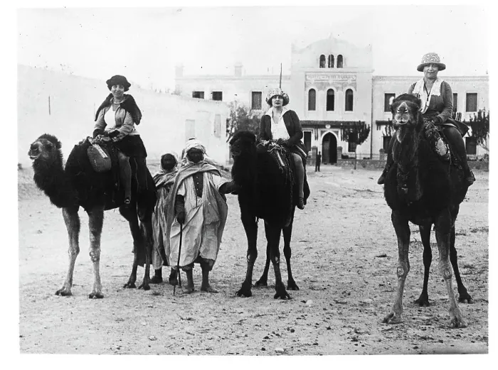 Framed Print : Tourists Ride Camels in the Sahara Framed Print : Tourists Ride Camels in the Sahara