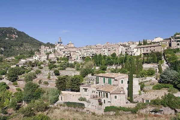 Townscape with Valldemossa Charterhouse and parish church of Sant Bartomeu, Valldemossa, Majorca, Balearic Islands, Spain