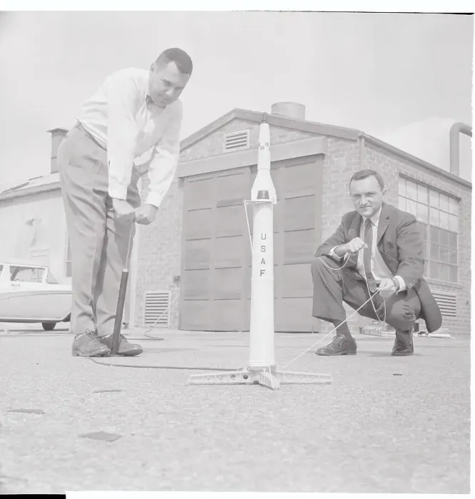 Framed Print : Toy Designers Testing Toy Missile Outdoors Framed Print : Toy Designers Testing Toy Missile Outdoors