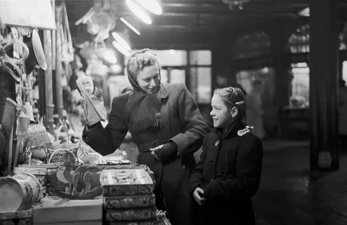 Framed Print : Toy Stall. 5th February 1949: A young customer talking to Mrs Green of Reed's Toys Framed Print : Toy Stall. 5th February 1949: A young customer talking to Mrs Green of Reed's Toys
