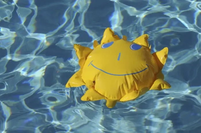 Framed Print : Toy sun floating in a swimming pool Framed Print : Toy sun floating in a swimming pool