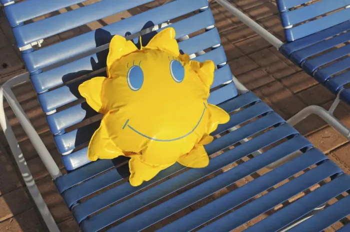 Framed Print : Toy sun lying on a sun lounger Framed Print : Toy sun lying on a sun lounger