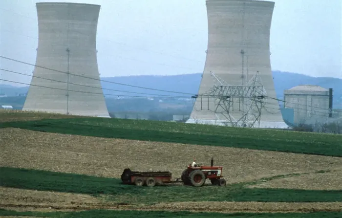 Framed Print : Tractor Driving Past Nuclear Power Plant Framed Print : Tractor Driving Past Nuclear Power Plant