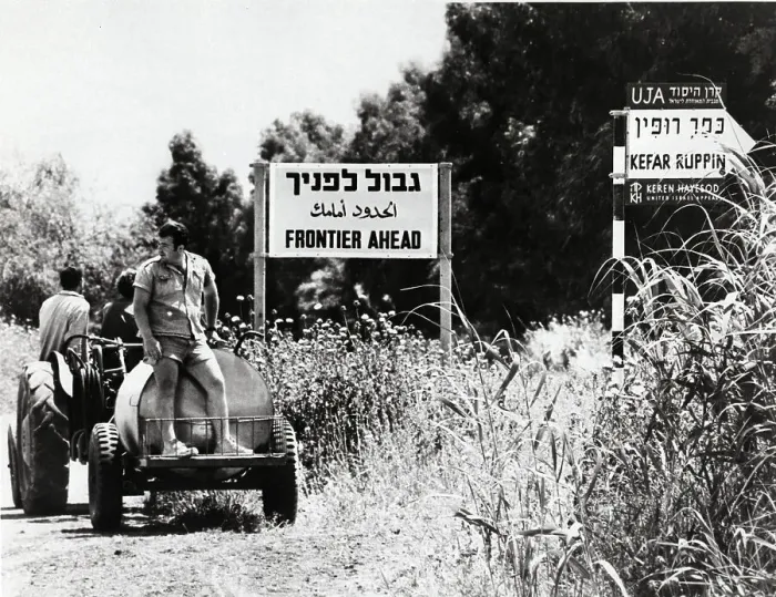 Framed Print : Tractor Passing Two Signs Framed Print : Tractor Passing Two Signs