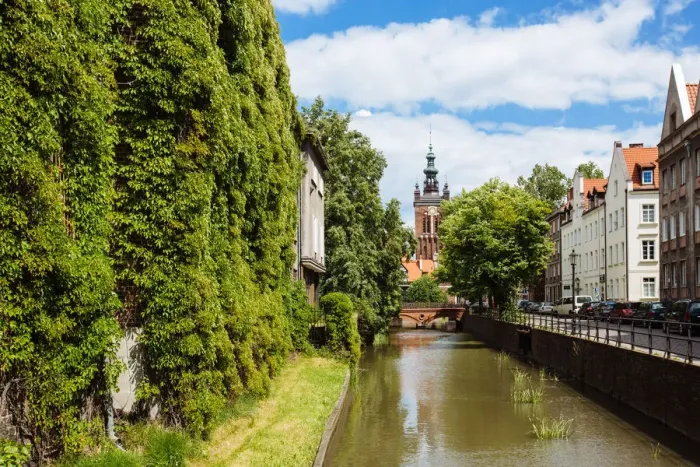 Framed Print : Traditional historic houses covered with ivy on a canal in the old town of Gdansk, Poland Framed Print : Traditional historic houses covered with ivy on a canal in the old town of Gdansk, Poland