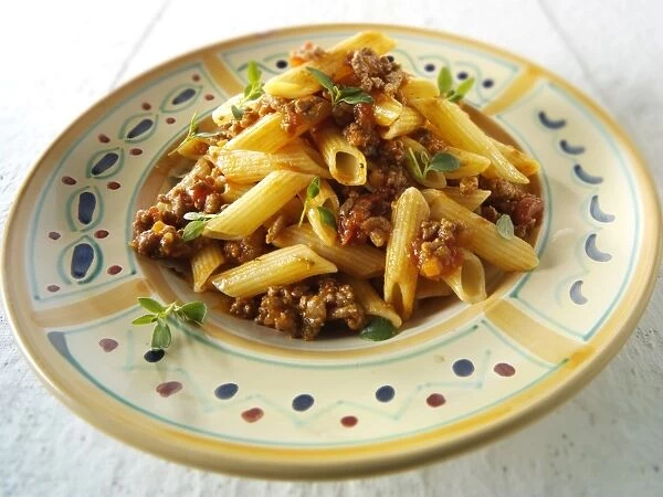 Traditional Penne pasta with bolognese sauce
