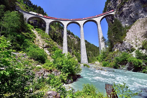A train of the Rhaetian Railway on the Landwasser Viaduct, UNESCO World Heritage Site, near Filisur, Canton of Grisons, Switzerland