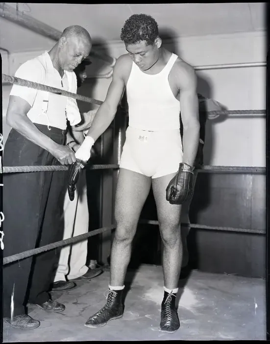Framed Print : Trainer Putting Gloves on Joe Louis Framed Print : Trainer Putting Gloves on Joe Louis