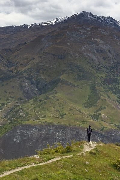 traveller looking at mountain in Queenstown, New Zealand