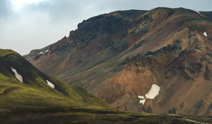 Framed Print : travellers walking at the volcanic landscape of landmannalaugar Framed Print : travellers walking at the volcanic landscape of landmannalaugar