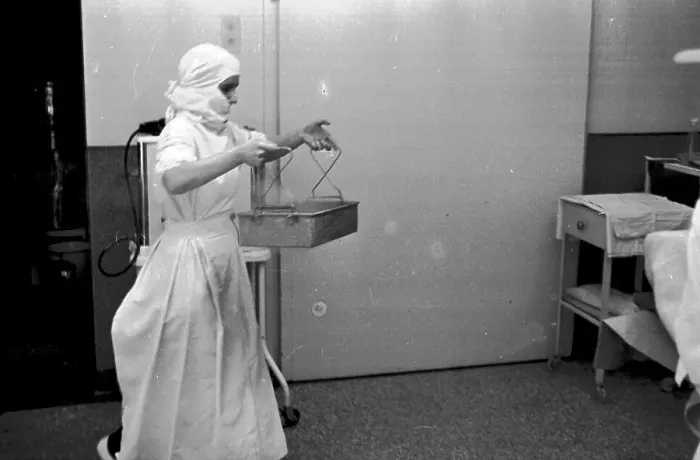 Framed Print : In Tray. 1st October 1938: A nurse brings sterile instruments into the Framed Print : In Tray. 1st October 1938: A nurse brings sterile instruments into the