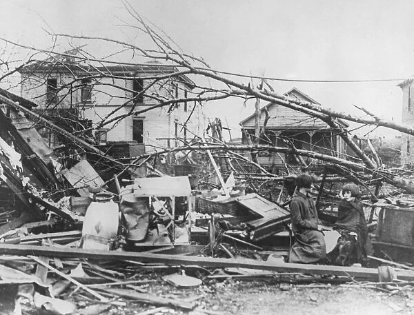 Tri-State Tornado. Minnie (left) and Rose Hawkins sit amongst the wreckage