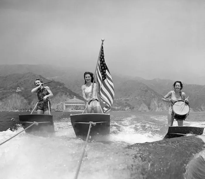 Framed Print : Trio Water Skiing with Flag Framed Print : Trio Water Skiing with Flag