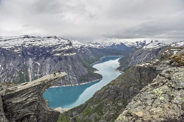 Trolltunga, Trolls Tongue, Ringedalsvatn reservoir below, Folgefonn Glacier at the back, near Odda, Hordaland province, Vestland or Western Norway, Norway