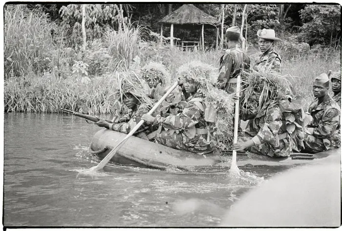 Framed Print : Troops In Camouflage Raft Down River Framed Print : Troops In Camouflage Raft Down River