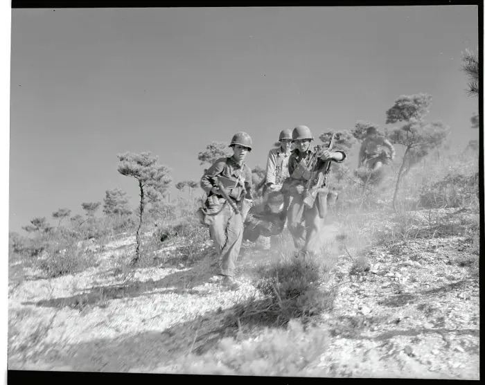 Framed Print : Troops Carrying a Victim over Terrain Framed Print : Troops Carrying a Victim over Terrain