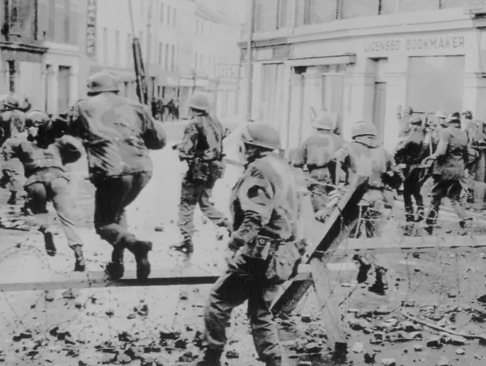Framed Print : Troops Jumping over Barbed Wire on Bloody Sunday Framed Print : Troops Jumping over Barbed Wire on Bloody Sunday