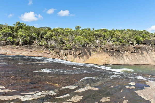 Tropical dry forest landscape with river and rocks, water flowing over cascades, rocky riverbed, Andohahela National Park, near Fort-Dauphin or Tolagnaro, Madagascar