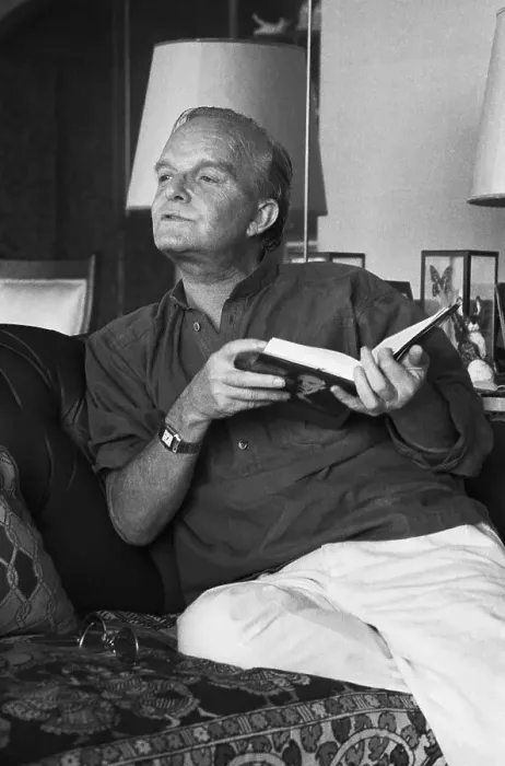 Framed Print : Truman Capote 3 / 4 Length On Sofa Talking