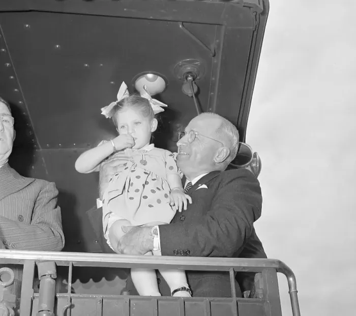 Framed Print : Truman Holding Little Girl Framed Print : Truman Holding Little Girl