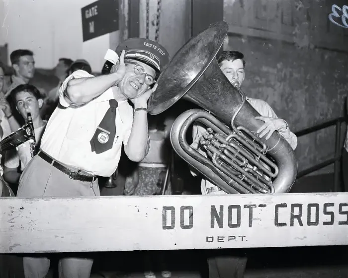 Framed Print : Tuba Player With Gate Keeper At Stadium