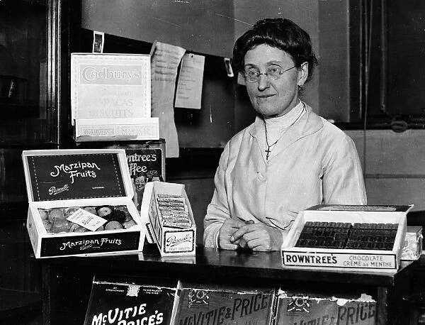 Tuck Shop. 23rd December 1925: Miss Houd, who runs the tuck shop at Westminster School
