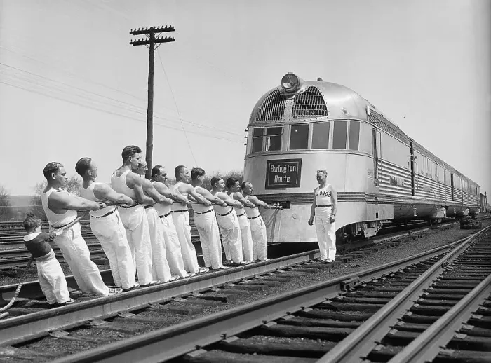 Framed Print : Tug-Of-War Team Pulls Train Framed Print : Tug-Of-War Team Pulls Train