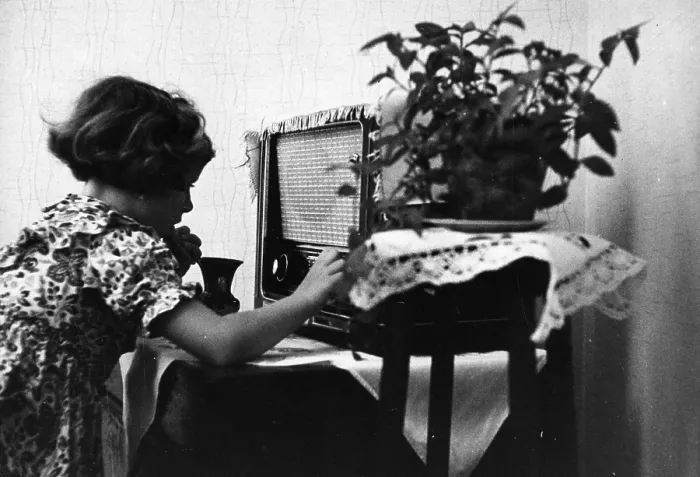 Framed Print : Tuning In. 26th November 1955: A child tunes in a radio at home Framed Print : Tuning In. 26th November 1955: A child tunes in a radio at home