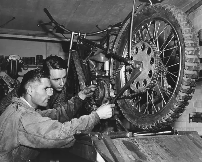 Framed Print : Tuning Up. 23rd September 1950: Motorcycle racer Tommy Price tinkering with his engine Framed Print : Tuning Up. 23rd September 1950: Motorcycle racer Tommy Price tinkering with his engine