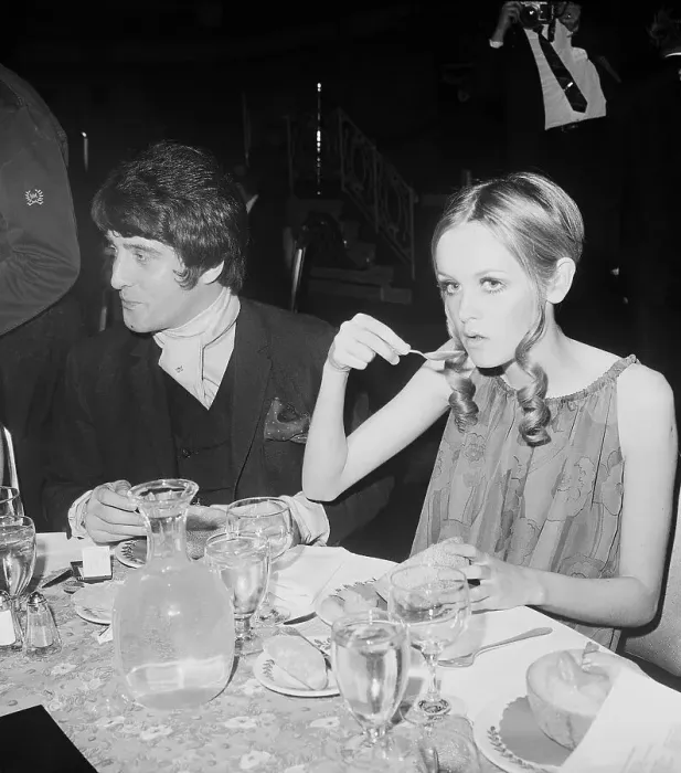Framed Print : Twiggy Eating at Party Framed Print : Twiggy Eating at Party