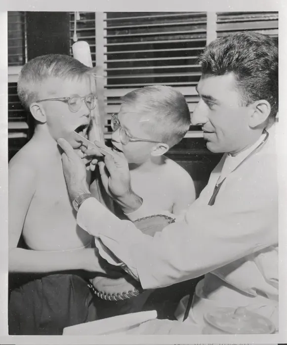 Framed Print : Twin Brothers Receiving Physical Exam from Doctor Framed Print : Twin Brothers Receiving Physical Exam from Doctor