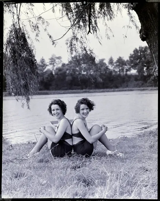 Framed Print : Twin Sisters Sitting Back to Back Framed Print : Twin Sisters Sitting Back to Back