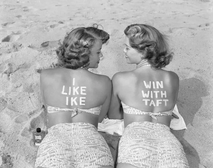 Framed Print : Twins on Beach Display Opposing Political Choices Framed Print : Twins on Beach Display Opposing Political Choices