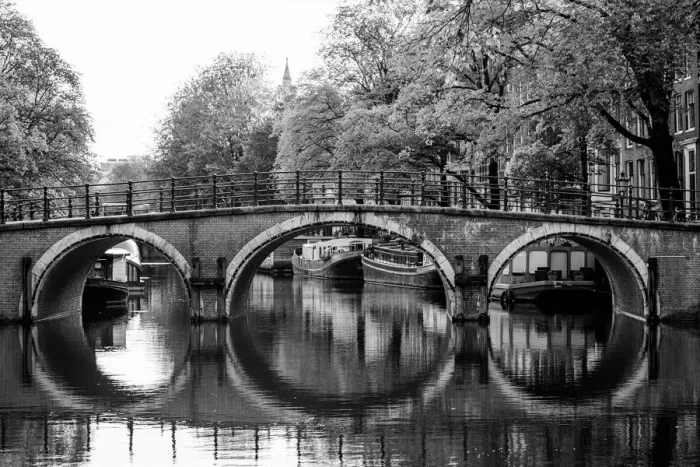 Framed Print : Typical arch bridge in Amsterdam in black and white Framed Print : Typical arch bridge in Amsterdam in black and white