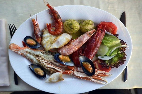 Typical fish dish with shrimps, mussels, whiting, octopus, boiled potatoes, Lanzarote, Canary Islands, Spain