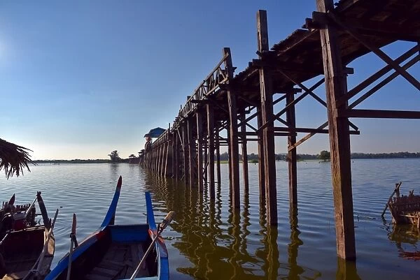 u bein bridge with tourist boat Myanmar