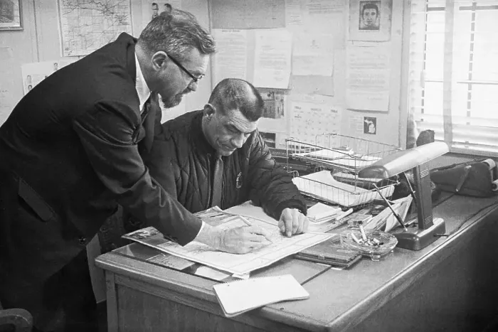 Framed Print : Ufo Expert & Police Chief Looking At Map Framed Print : Ufo Expert & Police Chief Looking At Map