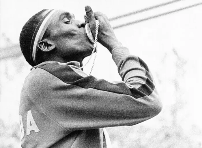 Framed Print : Ugandan Hurdler John Akii-Bua Kissing Gold Medal