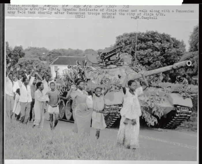 Framed Print : Ugandans Walking Along Army Tank Framed Print : Ugandans Walking Along Army Tank