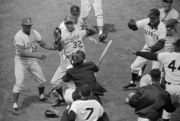Framed Print : Umpire Holding Back Player Charging Pitcher with a Bat Framed Print : Umpire Holding Back Player Charging Pitcher with a Bat