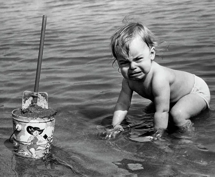 Framed Print : Unhappy Toddler in Cold Water at Beach Framed Print : Unhappy Toddler in Cold Water at Beach