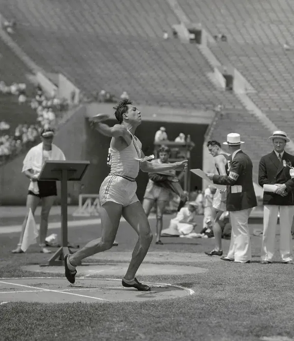 Framed Print : United States W. Charles Performing in The Decathlon Discus Event at Olympics
