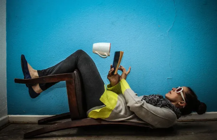 Framed Print : Unusual. trick photography model sitting on a chair upside down Framed Print : Unusual. trick photography model sitting on a chair upside down