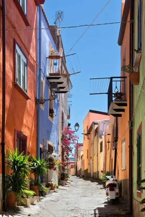 Framed Print : Uphill street with colourful architecture in Bosa, Sardinia, on a sunny day Framed Print : Uphill street with colourful architecture in Bosa, Sardinia, on a sunny day